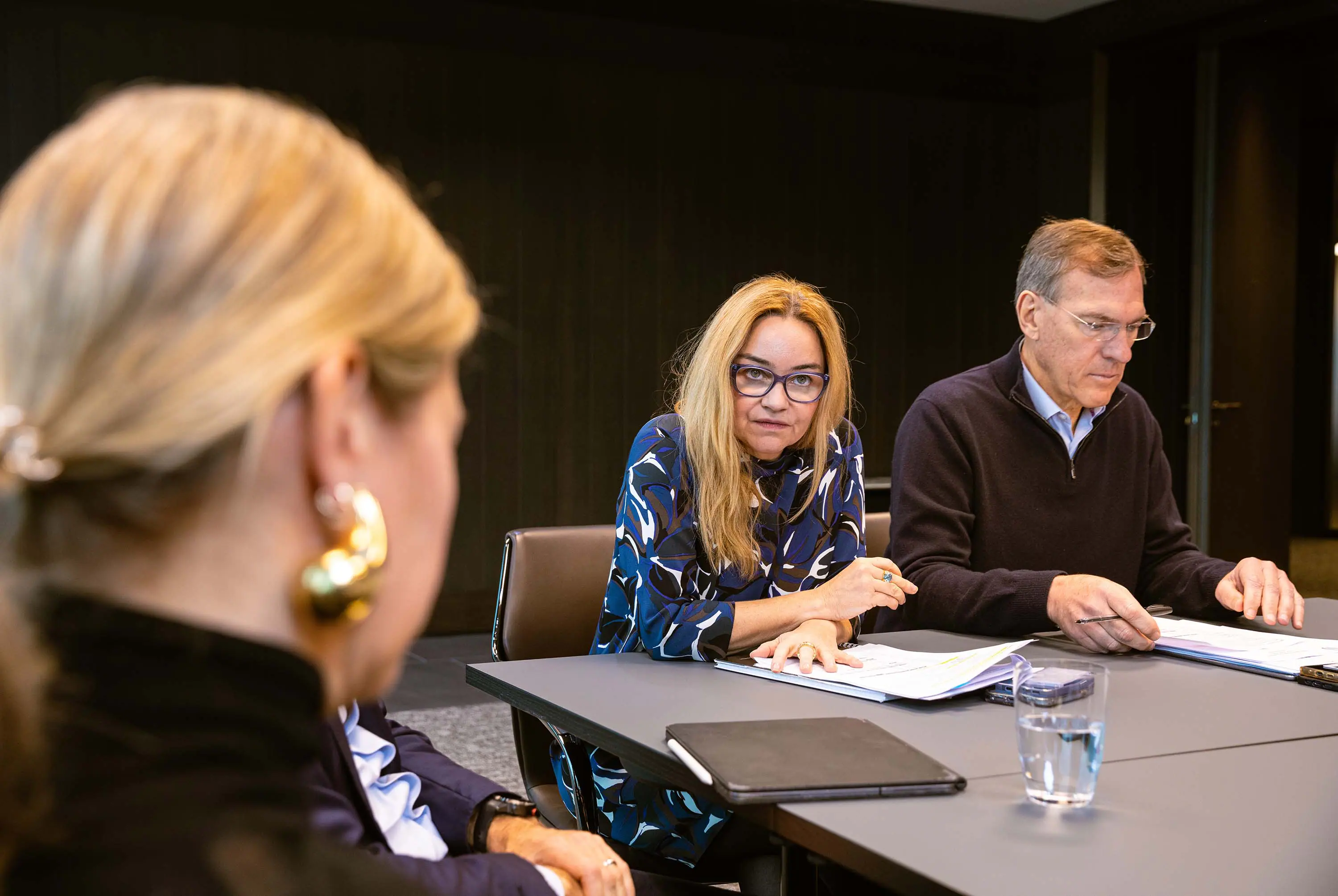 A professional woman planning her finances on a laptop